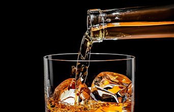 Pouring drink into a glass